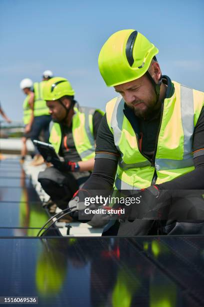 commercial solar panel install - power occupation stock pictures, royalty-free photos & images