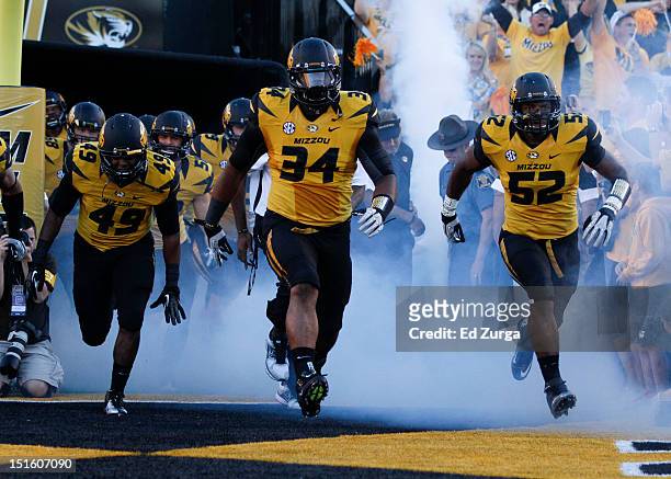 Sheldon Richardson of the Missouri Tigers leads his team onto the field before their game against the Georgia Bulldogs at Memorial Stadium on...