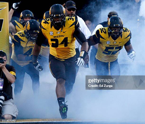 Sheldon Richardson of the Missouri Tigers leads his team onto the field before their game against the Georgia Bulldogs at Memorial Stadium on...