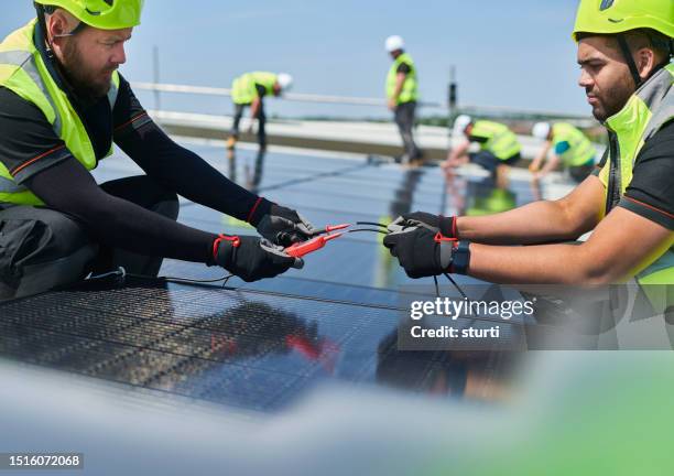 commercial solar panel install - solar powered station stock pictures, royalty-free photos & images