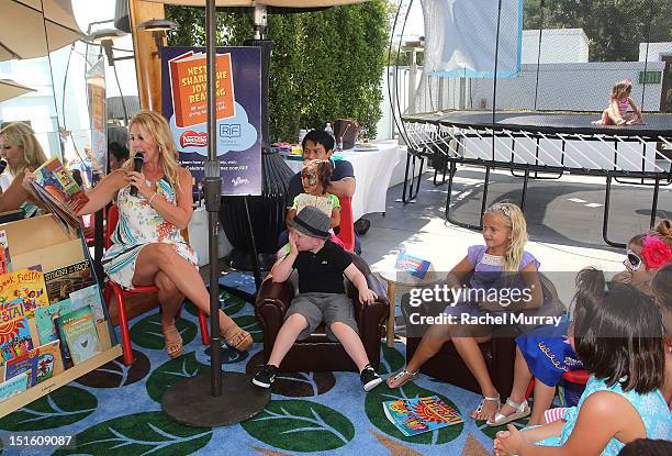 Personality Vicki Gunvalson reads to children during the Red CARpet event hosted by Britax and Ali Landry at SLS Hotel on September 8, 2012 in...