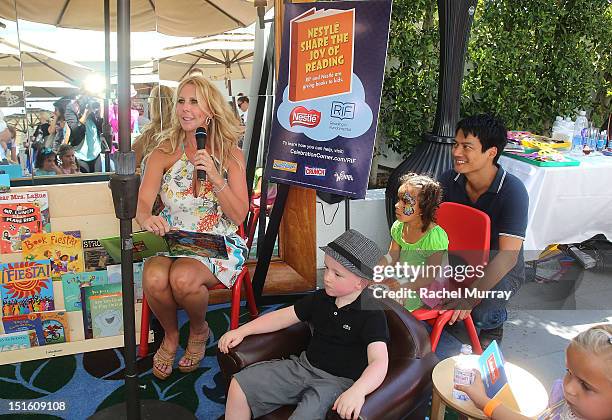 Personality Vicki Gunvalson reads to children during the Red CARpet event hosted by Britax and Ali Landry at SLS Hotel on September 8, 2012 in...