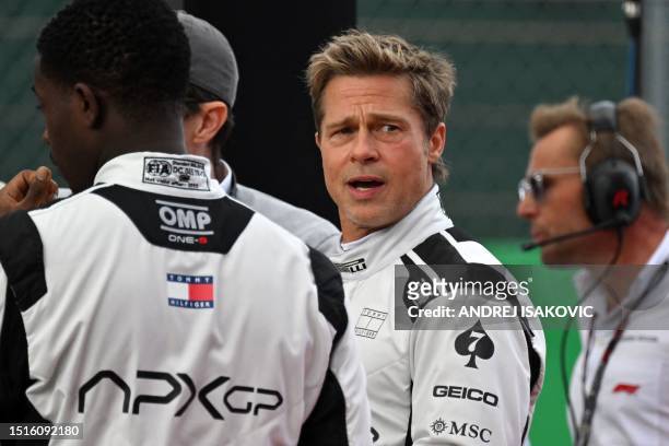 Actor Brad Pitt, starring as a driver in an F1-inspired movie, is seen prior to the Formula One British Grand Prix at the Silverstone motor racing...