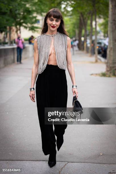 Mary Leest wears a crystals top, black pants, black bag and silver bracelets, outside Alexandre Vauthier, during the Haute Couture Fall/Winter...