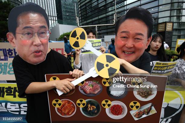 South Korean protesters wearing masks of Japanese Prime Minister Kishida and South Korea’s President Yoon Suk-Yeol during a protest against the...