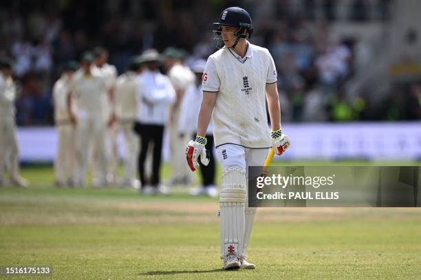 England's Harry Brook reacts as he walks back to the pavilion after losing his wicket for 75 runs on day four of the third Ashes cricket Test match...