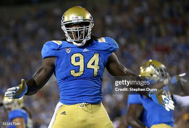 Defensive lineman Owamagbe Odighizuwa of the UCLA Bruins celebrates a UCLA safety against the Nebraska Cornhuskers in the fourth quarter at the Rose...