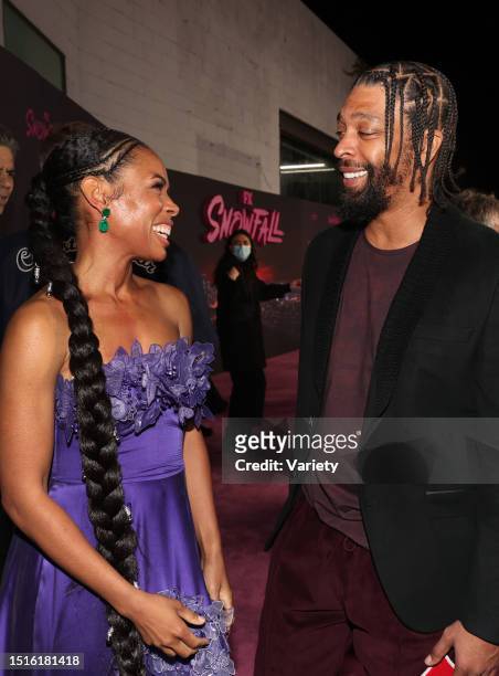 Angela Lewis and DeRay Davis at the premiere of 'Snowfall' Season 5 held at Grandmaster Recorders on February 17, 2022 in Los Angeles, California.