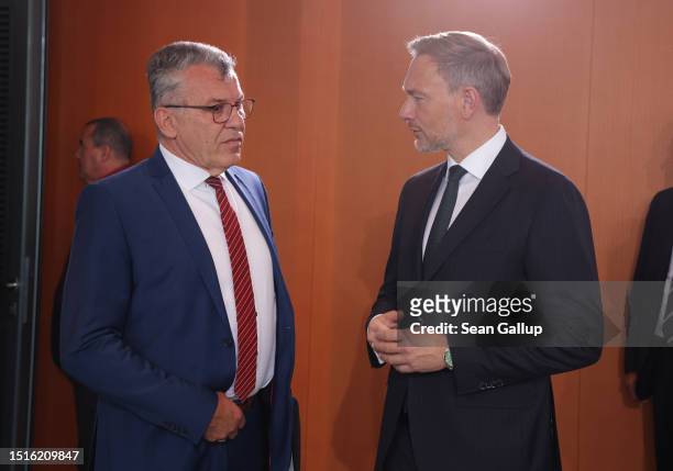 German Finance Minister Christian Lindner chats with Finance Ministry state secretary Werner Gatzer prior to a meeting of the federal government...