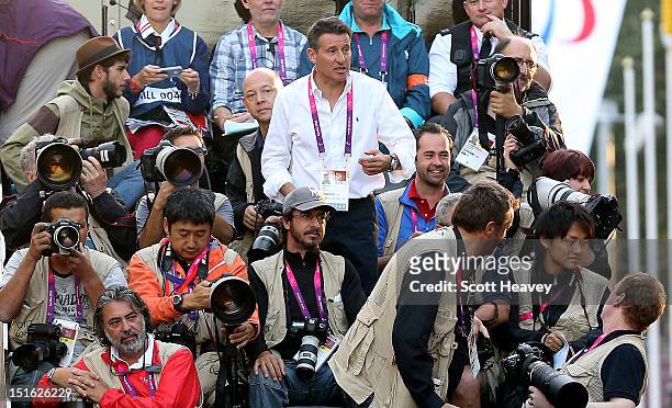 Chairman Lord Sebastian Coe stands amongst photographers prior to the T12 and T46 Men's Marathon on day 11 of the London 2012 Paralympic Games on The...