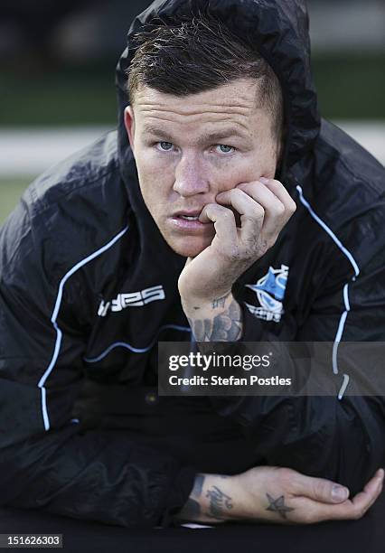 Todd Carney of the Sharks watches on after being sidelined with an injury during the Second NRL Elimination Final match between the Canberra Raiders...