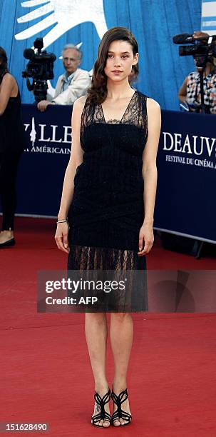 French actress Astrid Bergès-Frisbey poses on the red carpet as she arrives to attend the awarding ceremony off the 38th Deauville's US Film Festival...