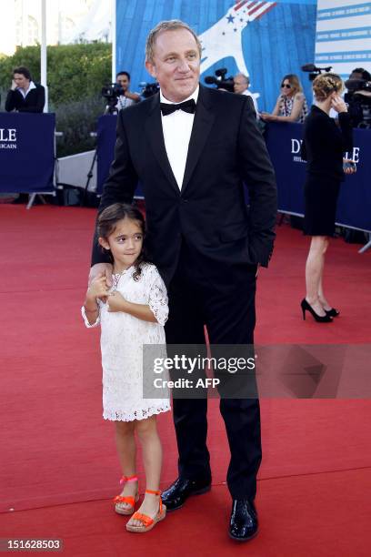 Salma Hayek's husband and French luxury and retail group PPR Chairman and CEO Francois-Henri Pinault poses on the red carpet with his daughter...