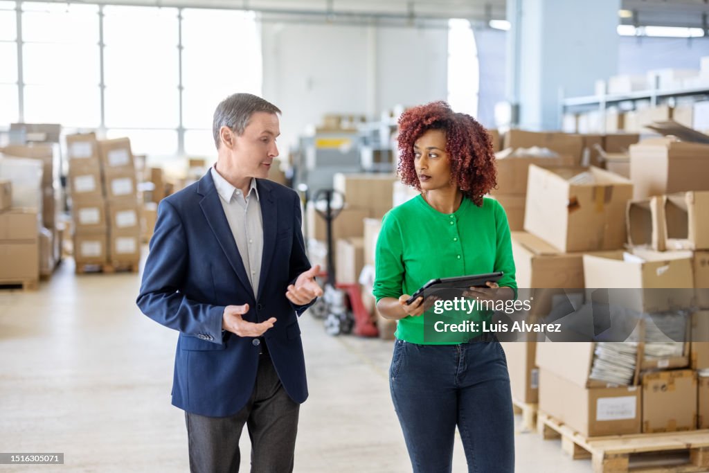 Management Owner Warehouse Owner And Manager Discussing Stock And Logistics In Plant ...
