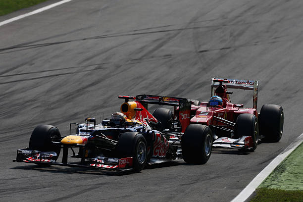 MONZA, ITALY - SEPTEMBER 09: Sebastian Vettel of Germany and Red Bull Racing leads from Fernando Alonso of Spain and Ferrari during the Italian Formula One Grand Prix at the Autodromo Nazionale di Monza on September 9, 2012 in Monza, Italy.