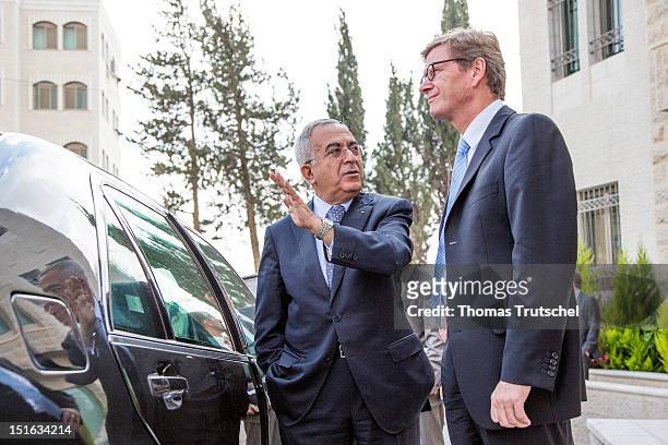 German Foreign Minister Guido Westerwelle and Palestinian Prime Minister Salam Fayyad speak after their meeting on September 9, 2012 in the West Bank...