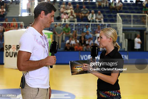 Henning Fritz, sport 1 television channel expert talks to sport 1 moderator Anett Sattler during the DKB Handball Bundesliga match between TUSEM...