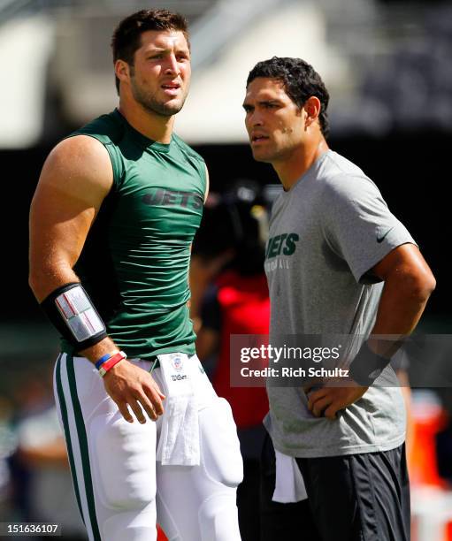 Quarterbacks Tim Tebow and Mark Sanchez of the New York Jets during pre-game warm ups before the start of their game against the Buffalo Bills at...