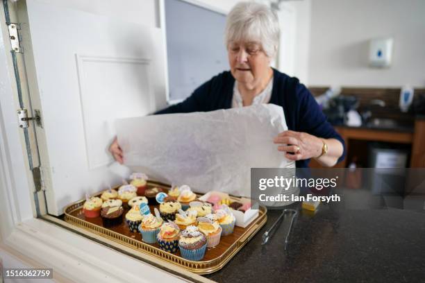 Cakes are prepared at an NHS 75 Big Tea anniversary event at Northallerton town hall on July 05, 2023 in Northallerton, England. The NHS was founded...