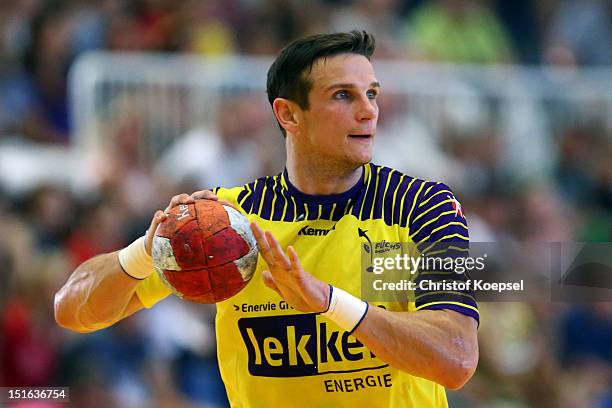 Bartolomiej Jaszka of Berlin passes the ball during the DKB Handball Bundesliga match between TUSEM Essen and Fueches Berlin at the Sportpark Am...