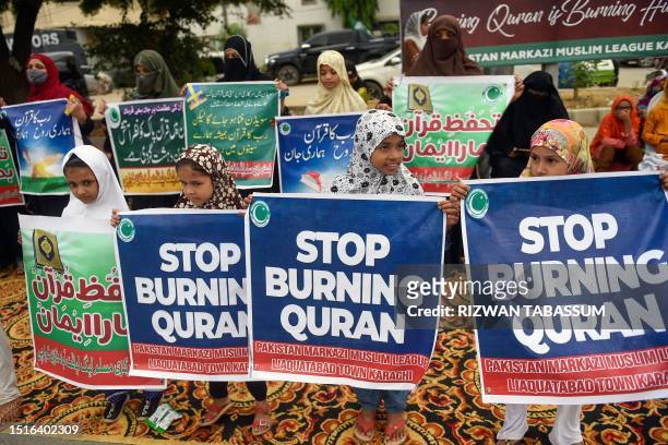 Activists and supporters of Pakistan Markazi Muslim League party take part in an anti-Sweden demonstration in Karachi on July 9 as they protest...
