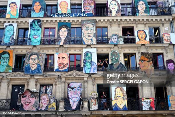 People visit 59 Rivoli Art Gallery as art works of French artist Cesar Seize are exhibit on the building facade in Paris, on July 9, 2023. /...