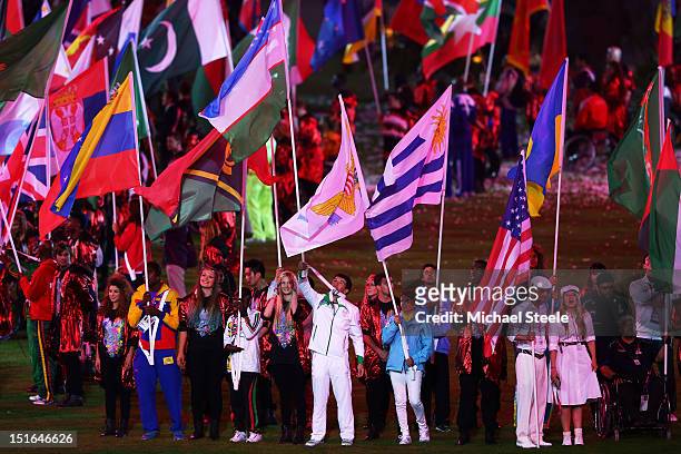 Flag bearers carry their national flags during the closing ceremony on day 11 of the London 2012 Paralympic Games at Olympic Stadium on September 9,...