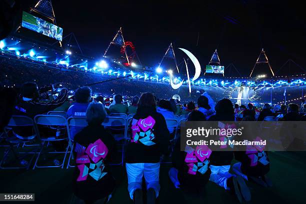 Volunteers watch the closing ceremony on day 11 of the London 2012 Paralympic Games at Olympic Stadium on September 9, 2012 in London, England.