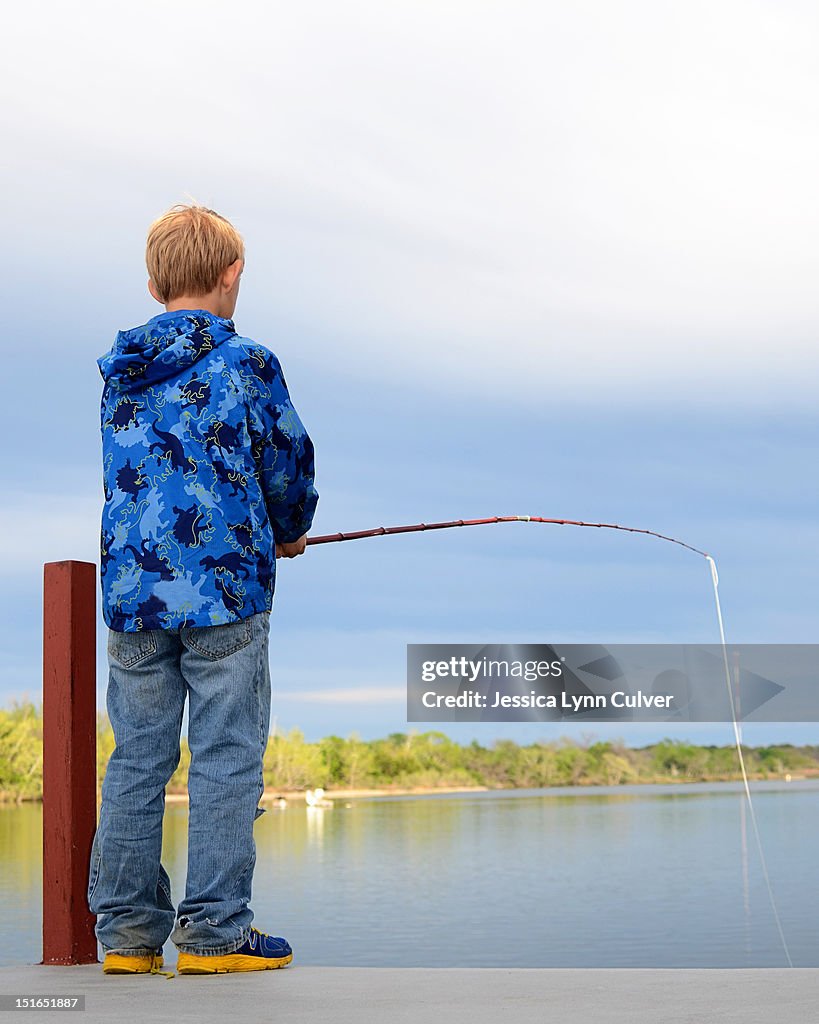 Young Boy Cane Pole Fishing High-Res Stock Photo - Getty Images