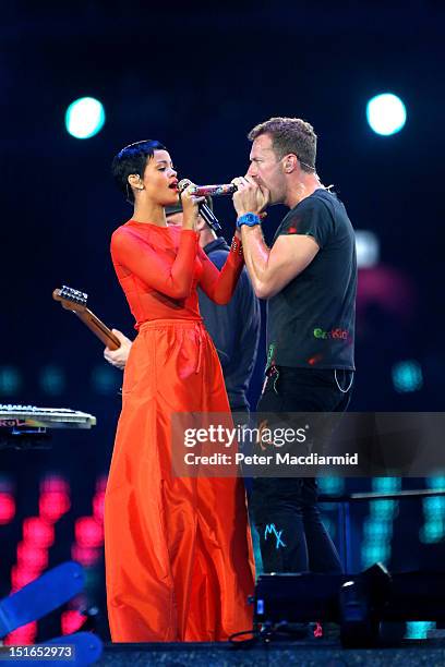 Rihanna performs with Chris Martin of Coldplay during the closing ceremony on day 11 of the London 2012 Paralympic Games at Olympic Stadium on...