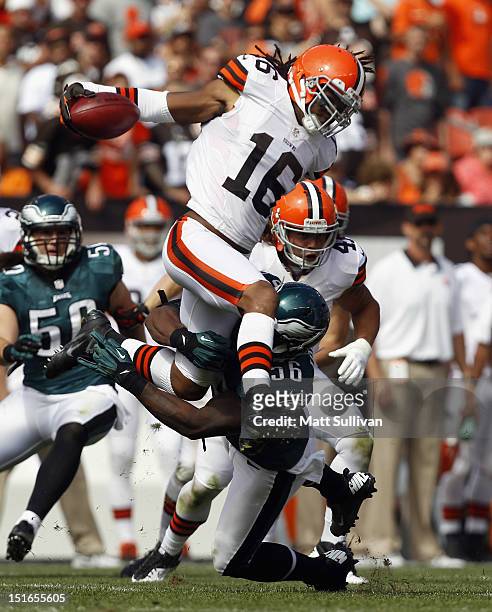 Wide receiver Joshua Cribbs of the Cleveland Browns is hit by linebacker Akeem Jordan of the Philadelphia Eagles during the season opener at...