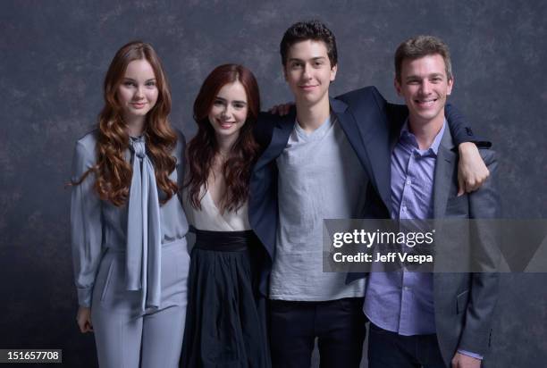 Actors Liana Liberato, Lily Collins, Nat Wolff and director Josh Boone of "Writers" pose at the Guess Portrait Studio during 2012 Toronto...