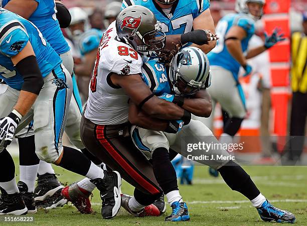 Defensive tackle Gerald McCoy of the Tampa Bay Buccaneers tackles running back DeAngelo Williams of the Carolina Panthers during the game at Raymond...