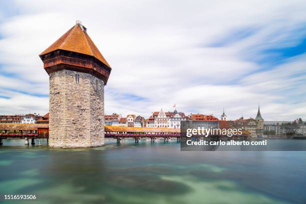 view of the kapellbrücke bridge and the wasserturm over the reuss river, during a sunny summer day, lucerne, canton of lucerne, switzerland - lake lucerne stock pictures, royalty-free photos & images