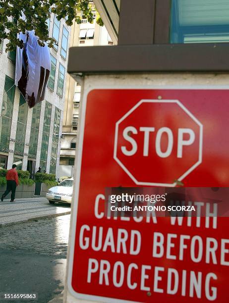 Sign is written in english in front of the security area at the American embassy in Rio de Janeiro, advertising to check with the guard before...