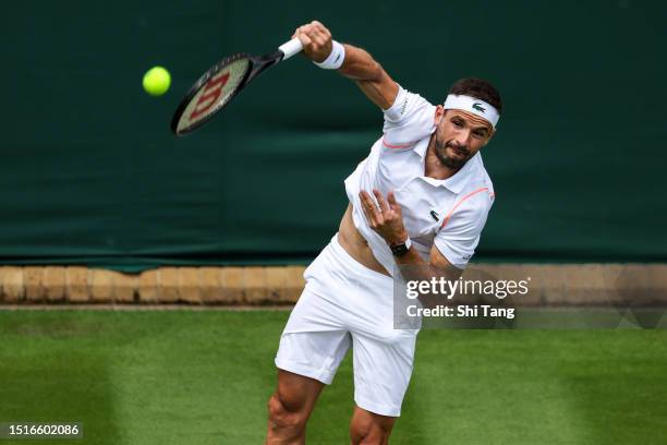 Grigor Dimitrov of Bulgaria serves in the Men's Singles first round match against Sho Shimabukuro of Japan during day three of The Championships...