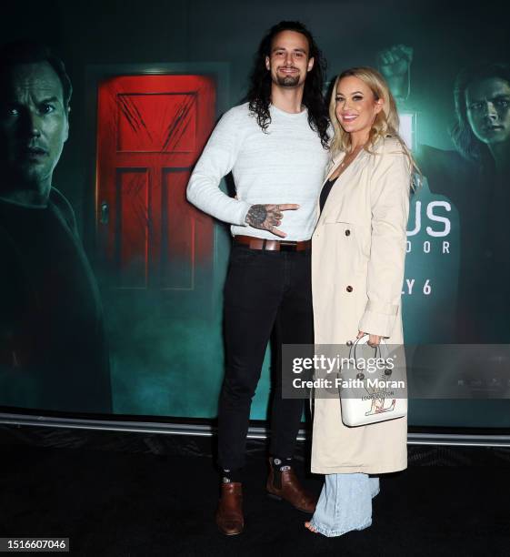 Jesse Burford and friend arrive at the Insidious The Red Door Premiere at Event Cinemas Innaloo on July 5, 2023 in Perth, Australia.