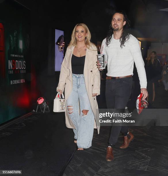 Jesse Burford and friend arrive at the Insidious The Red Door Premiere at Event Cinemas Innaloo on July 5, 2023 in Perth, Australia.
