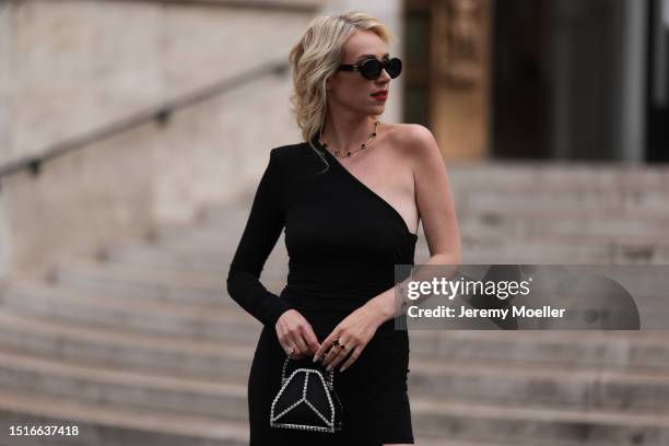 Marina von Lison seen wearing Celine black oval shaped Triomphe sunglasses, Van Cleef & Arpels black / gold necklace / bracelet and ring, Alexandre...