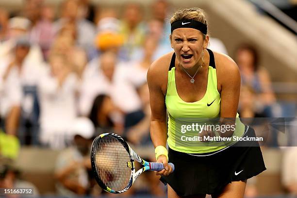 Victoria Azarenka of Belarus celebrates a point during the women's singles final match against Serena Williams of the United States on Day Fourteen...