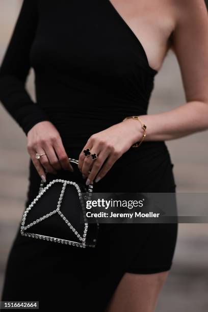 Marina von Lison seen wearing Van Cleef & Arpels black / gold bracelet and ring, Alexandre Vauthier black asymmetrical off-shoulder / long sleeve...
