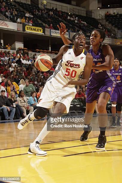 Jessica Davenport of the Indiana Fever drives on Krystal Thomas of the Phoenix Mercury at Banker's Life Fieldhouse on September 9, 2012 in...