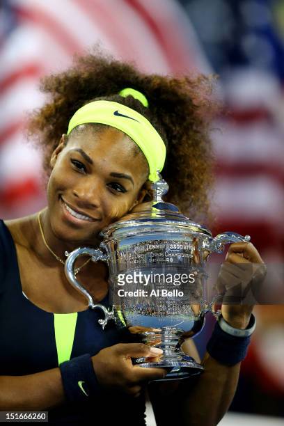 Serena Williams of the United States hugs the championship trophy after defeating Victoria Azarenka of Belarus to win the women's singles final match...