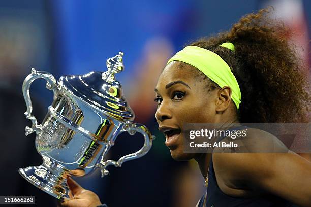 Serena Williams of the United States poses with the championship trophy after defeating Victoria Azarenka of Belarus to win the women's singles final...