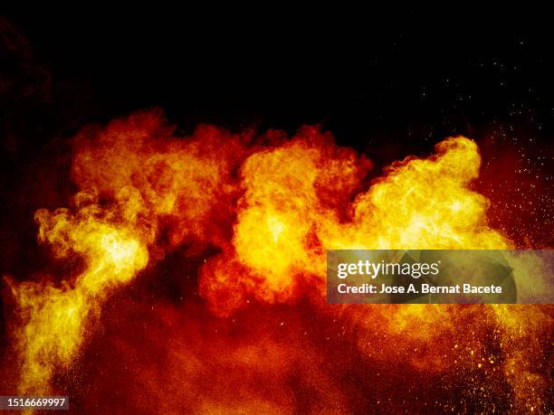 big explosion with a cloud of smoke and fire on a black background - horror of war stock pictures, royalty-free photos & images