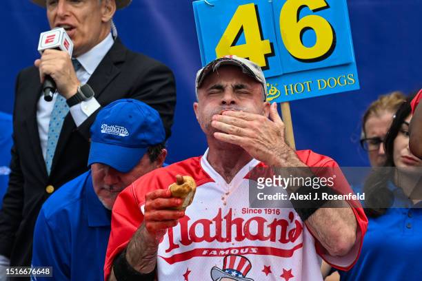 Geoffrey Esper competes in the 2023 Nathan's Famous Fourth of July International Hot Dog Eating Contest at Coney Island on July 04, 2023 in the...