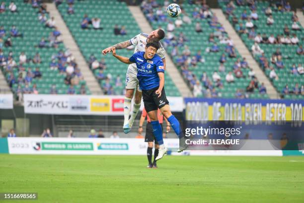 Of FC Machida Zelvia and Tomoya ANDO of Oita Trinita battle for the ball during the J.LEAGUE Meiji Yasuda J2 24th Sec. Match between Oita Trinita and...