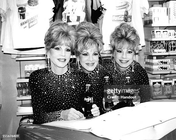 Christine McGuire, Phyllis McGuire and Dorothy McGuire of The McGuire Sisters attend the opening of the World of Coca-Cola on July 7, 1997 in Las...