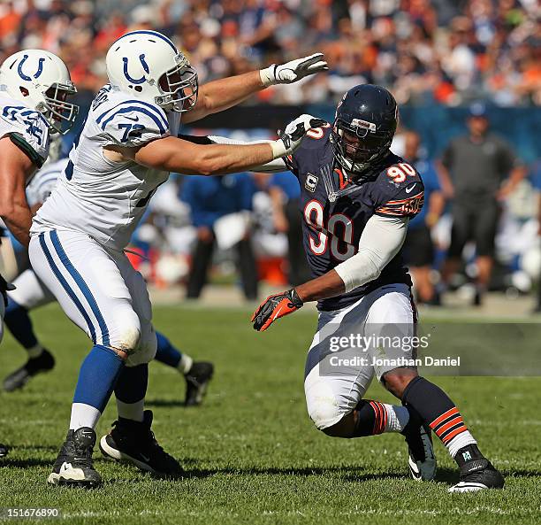 Julius Peppers of the Chicago Bears rushes against Jeff Linkenbach of the Indianapolis Colts during their 2012 NFL season opener at Soldier Field on...