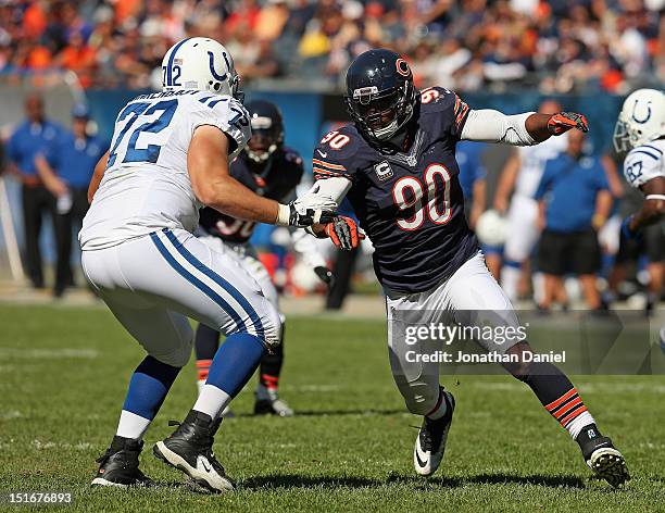 Julius Peppers of the Chicago Bears rushes against Jeff Linkenbach of the Indianapolis Colts during their 2012 NFL season opener at Soldier Field on...